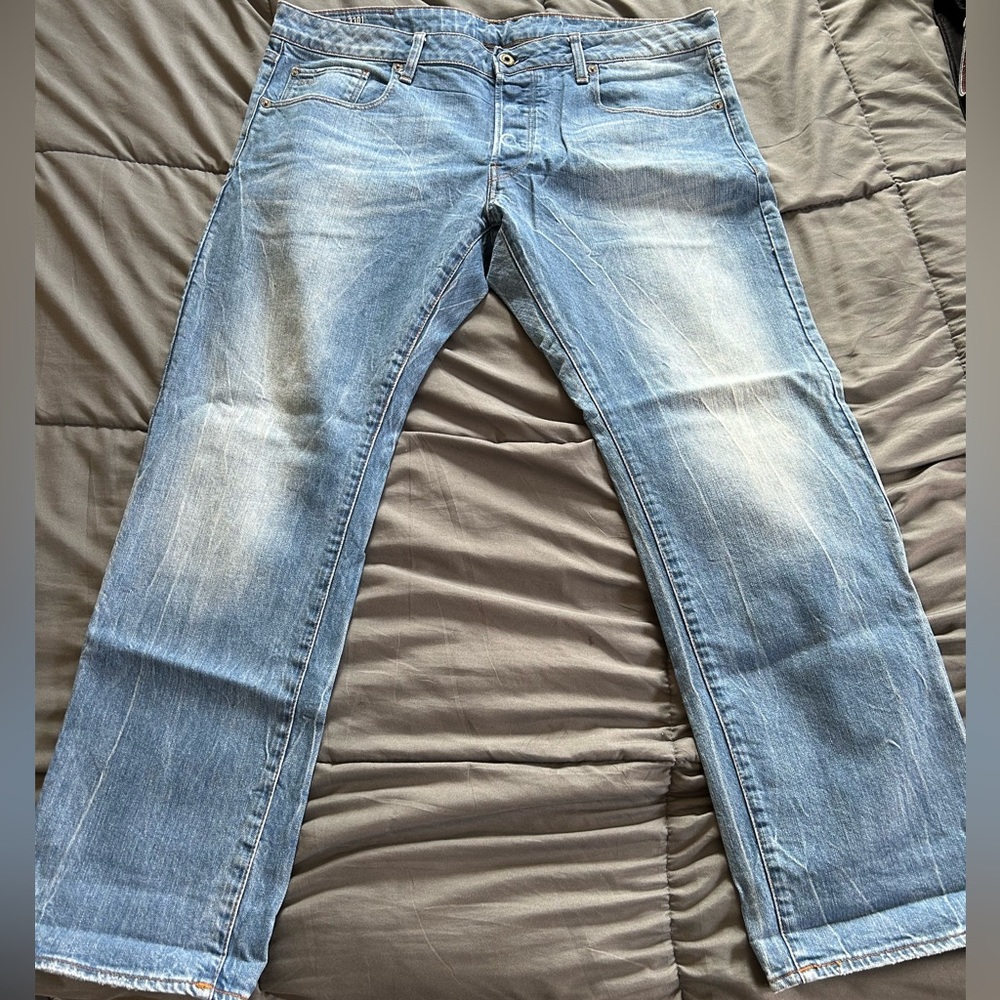 Men’s faded blue jeans